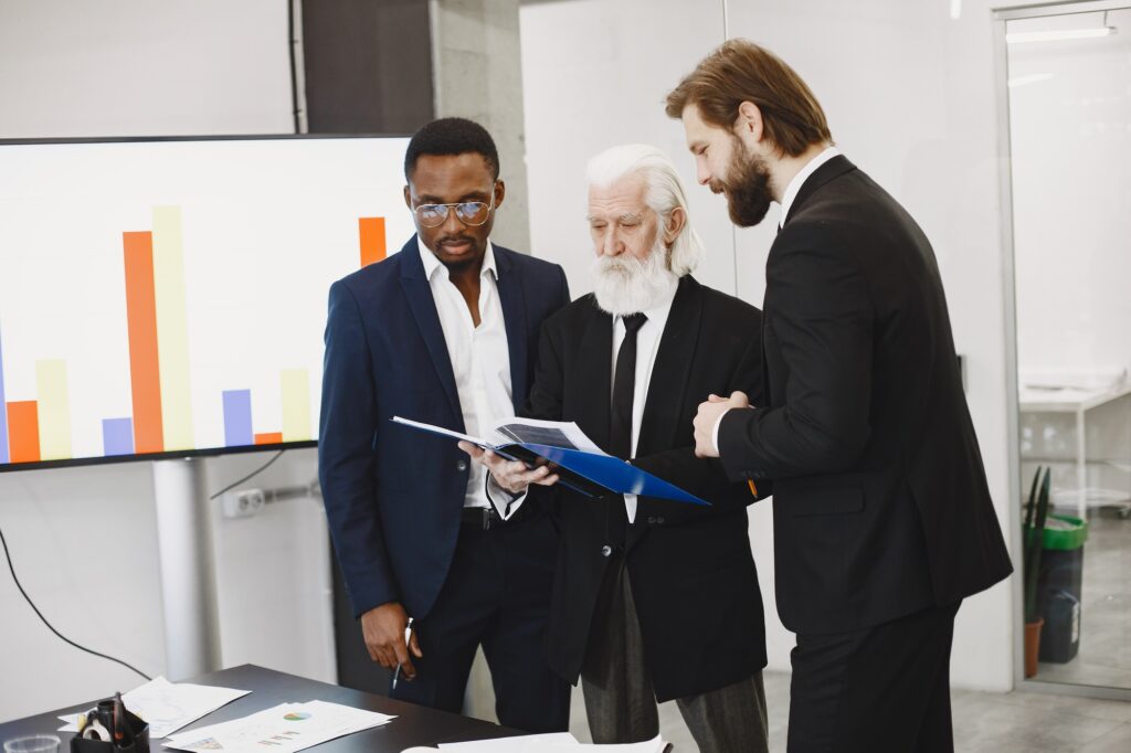 Three busines partners men in the office